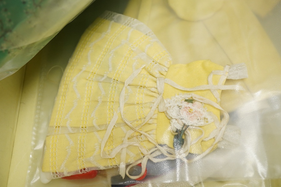 A 1960's Mattel Inc. Barbie doll, 1963, together with a Skipper doll, and a collection of eight original outfits with accessories, sorted into individual packets, outfits purchased between 1963 to 1966 include; American